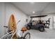 Garage featuring leisure equipment including a golf cart, surfboard, and bicycle at 3803 Palm Blvd, Isle of Palms, SC 29451
