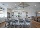 Bright, open kitchen with large island, pendant lighting, and stainless steel appliances at 3803 Palm Blvd, Isle of Palms, SC 29451