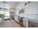 Bright, white kitchen with stainless steel appliances and a large island at 3803 Palm Blvd, Isle of Palms, SC 29451
