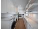 Spacious laundry room with modern washer/dryer, ample counter space and built-in cabinetry at 3803 Palm Blvd, Isle of Palms, SC 29451