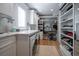 Well-organized laundry room with marble countertop, built-in shelves, and front-load washer/dryer at 3803 Palm Blvd, Isle of Palms, SC 29451