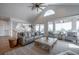 Inviting living room with high ceilings, large windows, comfortable seating, and scenic views at 3803 Palm Blvd, Isle of Palms, SC 29451