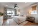 Light filled main bedroom features a ceiling fan and private balcony with ocean views at 3803 Palm Blvd, Isle of Palms, SC 29451