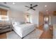 Spacious main bedroom features a king bed, ceiling fan, and ensuite bathroom entrance at 3803 Palm Blvd, Isle of Palms, SC 29451