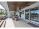 Covered outdoor dining area with ceiling fans and tile flooring at 3803 Palm Blvd, Isle of Palms, SC 29451