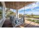 Relaxing porch swing with comfortable cushions offers a serene spot with a great view at 3803 Palm Blvd, Isle of Palms, SC 29451