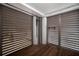 Airy room with light streaming through louvers onto beautiful wood floors at 3803 Palm Blvd, Isle of Palms, SC 29451