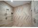 The tile shower is finished with dual shower heads and built in shelf at 3803 Palm Blvd, Isle of Palms, SC 29451