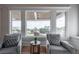Cozy sitting area with two armchairs and large windows overlooking the ocean at 3803 Palm Blvd, Isle of Palms, SC 29451