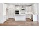Modern kitchen with white cabinets, stainless steel appliances, and a center island at 409 Cadbury Loop, Summerville, SC 29486