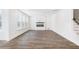 Spacious living room with modern fireplace, wood floors, and ample natural light at 409 Cadbury Loop, Summerville, SC 29486