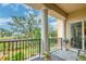 Scenic balcony with comfortable seating, pillars, and views of the water and landscape beyond at 4247 Faber Place Dr # 5103, North Charleston, SC 29405