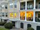 Exterior building view with balconies that have iron railings and white columns, offering outdoor living spaces at 4247 Faber Place Dr # 5103, North Charleston, SC 29405