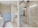 Walk-in shower featuring clear glass doors and dual shower heads plus access to the soaking tub at 4247 Faber Place Dr # 5103, North Charleston, SC 29405
