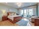 Comfortable bedroom with serene balcony access offering lots of natural light and beautiful views at 4247 Faber Place Dr # 5103, North Charleston, SC 29405