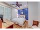 Nautical themed bedroom features hardwood floors, plantation shutters, and overhead fan at 4247 Faber Place Dr # 5103, North Charleston, SC 29405
