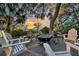 Inviting outdoor fire pit surrounded by comfortable seating with gorgeous trees and nature all around at 4247 Faber Place Dr # 5103, North Charleston, SC 29405