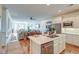 Open-concept kitchen and living room with hardwood floors and stainless steel appliances. Great flow for entertaining at 4247 Faber Place Dr # 5103, North Charleston, SC 29405