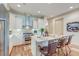 Stylish kitchen with white cabinets, stainless steel appliances, and an island with seating at 4247 Faber Place Dr # 5103, North Charleston, SC 29405