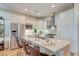 Modern kitchen with white cabinets, stainless steel appliances, quartz countertops and island with seating at 4247 Faber Place Dr # 5103, North Charleston, SC 29405