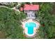 Aerial view of a T-shaped pool with surrounding lounge chairs and a covered patio at 4247 Faber Place Dr # 5103, North Charleston, SC 29405