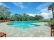 Community pool surrounded by trees, offering a cool and inviting space for relaxation and recreation at 4247 Faber Place Dr # 5103, North Charleston, SC 29405