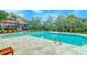 Beautiful pool area featuring inviting lounge chairs, lush greenery, and a community pool at 4247 Faber Place Dr # 5103, North Charleston, SC 29405