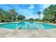Large community pool with palm trees and lounge chairs overlooking a scenic view at 4247 Faber Place Dr # 5103, North Charleston, SC 29405