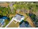 Aerial view of a charming home featuring a private backyard and a well-manicured front yard at 4281 Jacobs Point Ct, Ravenel, SC 29470