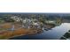 Aerial shot of waterfront community with dock, walkway, and marsh at 4281 Jacobs Point Ct, Ravenel, SC 29470