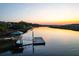 Scenic aerial view of a dock and gazebo on a river at sunset at 4281 Jacobs Point Ct, Ravenel, SC 29470