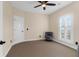 Bedroom with neutral walls, window with shutters, a chair, and a ceiling fan at 4281 Jacobs Point Ct, Ravenel, SC 29470