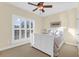 Cozy bedroom featuring a ceiling fan, plantation shutters and a comfortable queen size bed at 4281 Jacobs Point Ct, Ravenel, SC 29470
