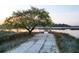 Waterfront property featuring a private dock with a gazebo overlooking the tranquil marsh and serene river at 4281 Jacobs Point Ct, Ravenel, SC 29470