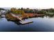 View of community dock and path surrounded by trees and marsh grass at 4281 Jacobs Point Ct, Ravenel, SC 29470