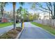 Community entrance with gate, landscaping, and security features for a safe and welcoming environment at 4281 Jacobs Point Ct, Ravenel, SC 29470