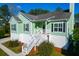 Charming elevated home with stairs to entry, a welcoming porch, and dark shutters at 4281 Jacobs Point Ct, Ravenel, SC 29470