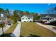 Beautiful green home with a long driveway and well-manicured lawn in a quiet neighborhood at 4281 Jacobs Point Ct, Ravenel, SC 29470