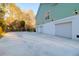Detached three-car garage with a light green exterior at 4281 Jacobs Point Ct, Ravenel, SC 29470