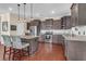 Modern kitchen with stainless steel appliances, granite countertops, and stylish pendant lighting over the island at 4281 Jacobs Point Ct, Ravenel, SC 29470