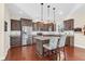 Updated kitchen featuring stainless steel appliances, granite countertops, and an island with seating at 4281 Jacobs Point Ct, Ravenel, SC 29470