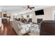 Bright living room featuring a fireplace, large windows with shutters, and sleek, neutral-toned furnishings at 4281 Jacobs Point Ct, Ravenel, SC 29470