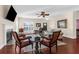 Inviting living room with fireplace, ceiling fan, plantation shutters and an open floor plan at 4281 Jacobs Point Ct, Ravenel, SC 29470