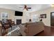 Inviting living room with plantation shutters, a fireplace, and cozy seating at 4281 Jacobs Point Ct, Ravenel, SC 29470