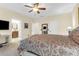 Bright main bedroom features a ceiling fan, neutral walls, and nearby access to the en suite bath at 4281 Jacobs Point Ct, Ravenel, SC 29470