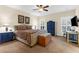 Comfortable main bedroom features a ceiling fan, natural light, and a closet at 4281 Jacobs Point Ct, Ravenel, SC 29470