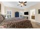 Well-lit main bedroom showcases a ceiling fan, neutral paint, and a tv at 4281 Jacobs Point Ct, Ravenel, SC 29470