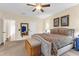 Spacious main bedroom with ceiling fan, comfortable furnishings, and well-lit vanity in the en suite bathroom at 4281 Jacobs Point Ct, Ravenel, SC 29470