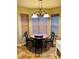 Cozy breakfast nook featuring a round table, decorative chandelier, and windows at 429 Stephanie Dr, Goose Creek, SC 29445