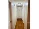 Hallway featuring hardwood floors and doors leading to various rooms in the home at 429 Stephanie Dr, Goose Creek, SC 29445
